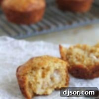 Brown Sugar Muffins Close-up of the delightful texture of a freshly baked Brown Sugar Muffin, showcasing its golden-brown top and tender crumb.