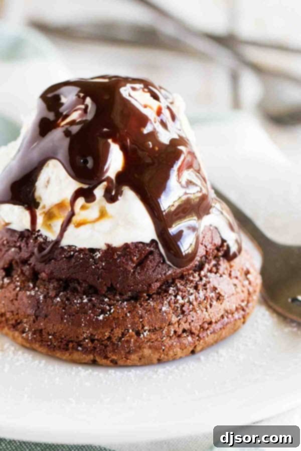 Freshly baked Chocolate Molten Lava Cakes cooling in ramekins before serving.