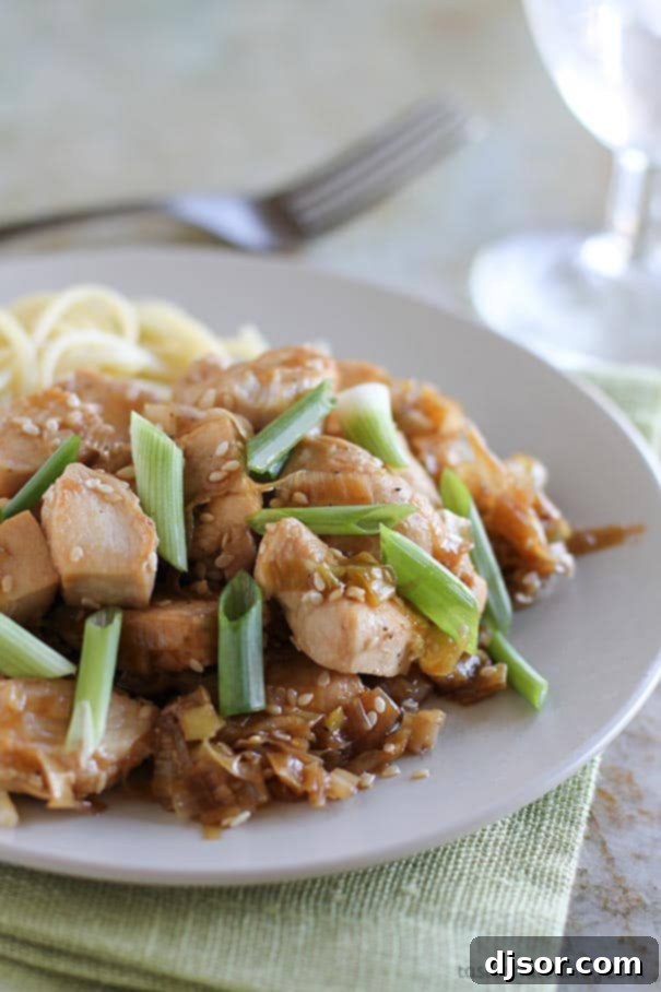 Golden Sesame Leek Chicken 2 Stir Fry Chicken with Sesame and Leeks - an easy dinner recipe that is done in 30 minutes. Golden brown chicken pieces, vibrant green leeks, and toasted sesame seeds are tossed in a savory sauce, ready to be served over rice or noodles.