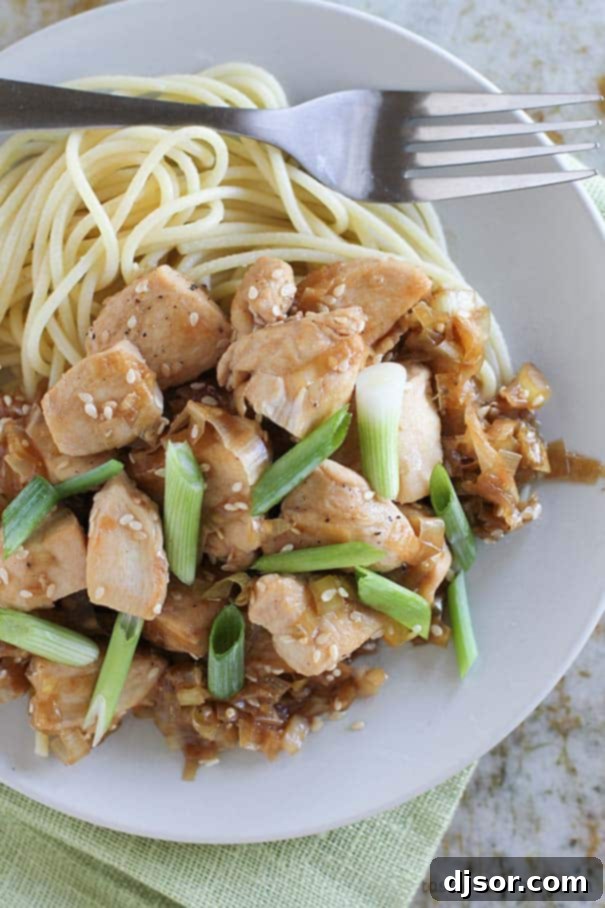 Golden Sesame Leek Chicken 3 A delicious and easy weeknight dinner idea: Stir Fry Chicken with Sesame and Leeks. Close-up of the finished dish, showcasing the vibrant colors and appealing texture of the chicken, leeks, and sesame seeds.