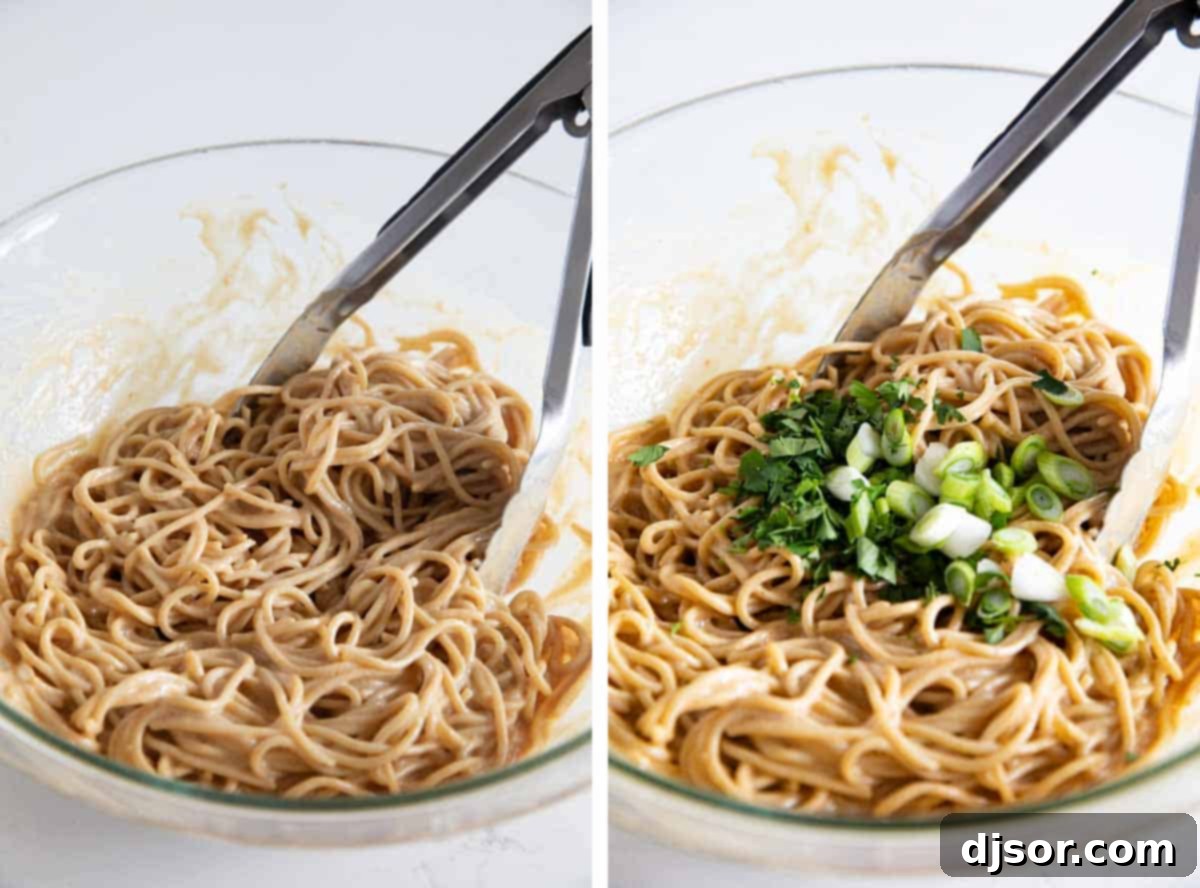 Thai Peanut Noodles being tossed with fresh green onions, cilantro, and creamy peanut sauce in a large bowl, showcasing the colorful ingredients.