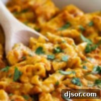 The ultimate comfort food, this Pumpkin Cheddar Mac and Cheese is the perfect way to add a pumpkin twist to this dinner that is perfect for cold, chilly nights.