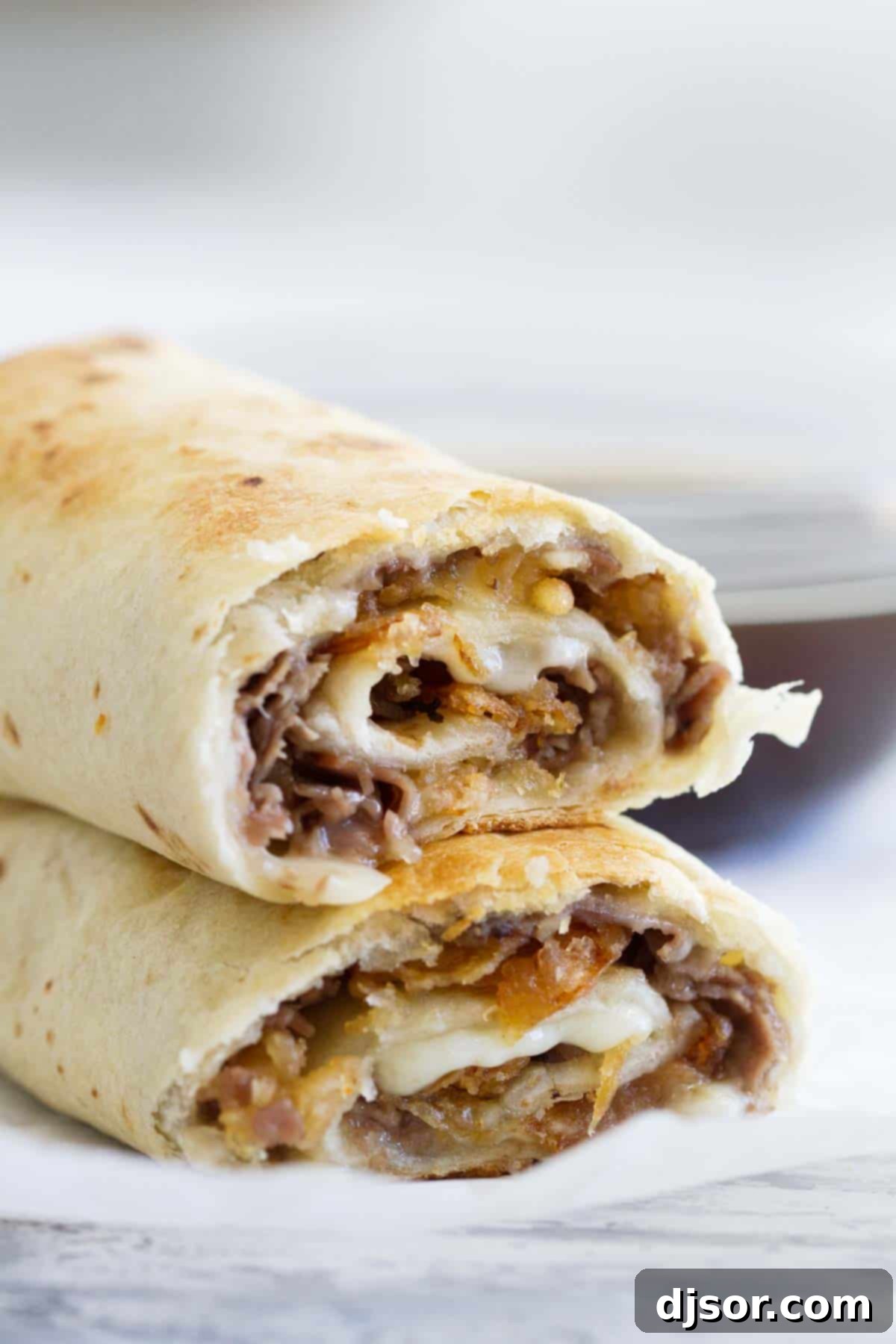 French Dip Tortilla Roll Ups cut in half and stacked