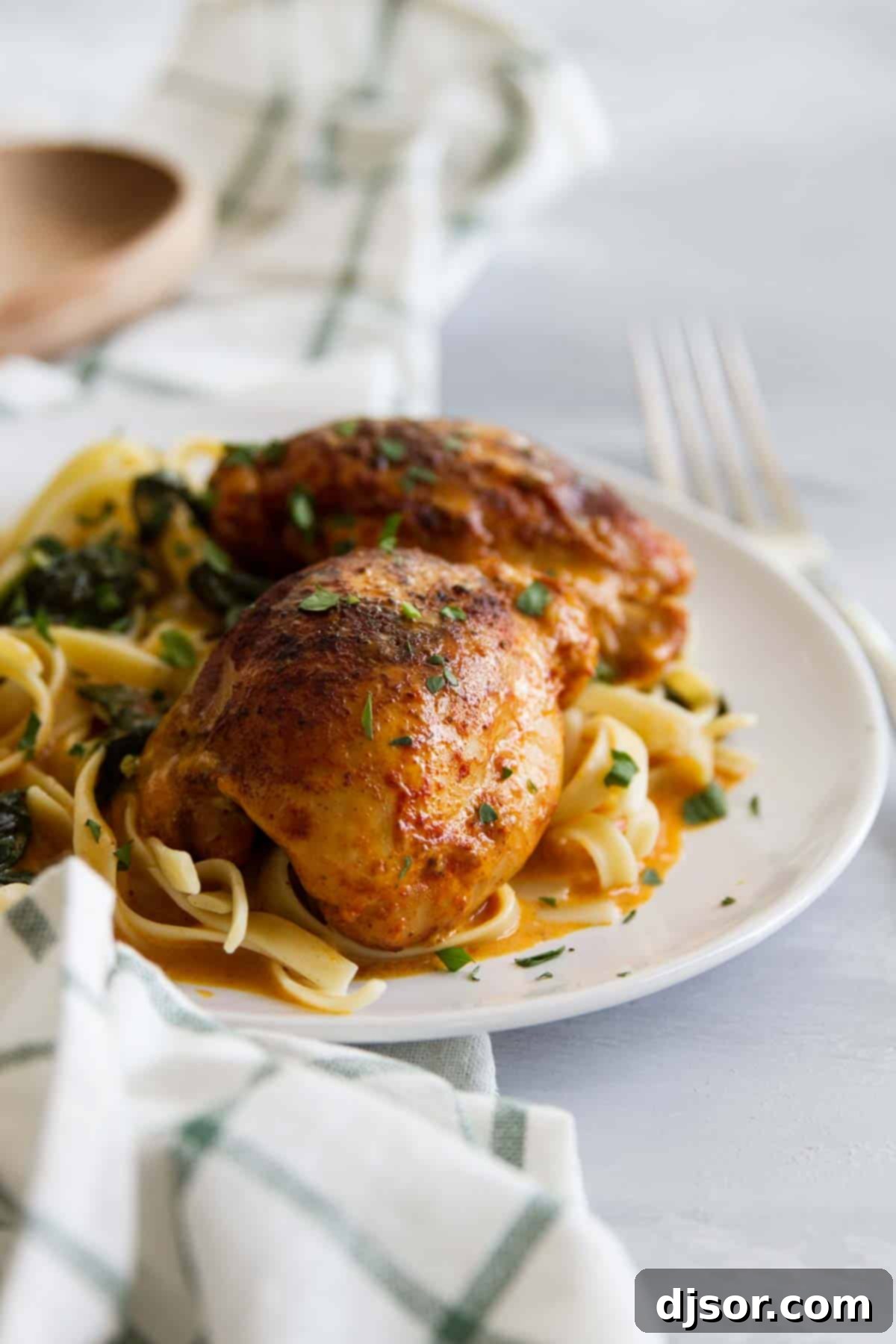 Restaurant quality at home - these Garlic Paprika Instant Pot Chicken Thighs make even a weeknight special! Seasoned boneless chicken thighs are served in a delicious cream sauce - perfect for a date night in! Pressure Cooker Chicken Thighs with Garlic and Paprika with fresh herbs on top.