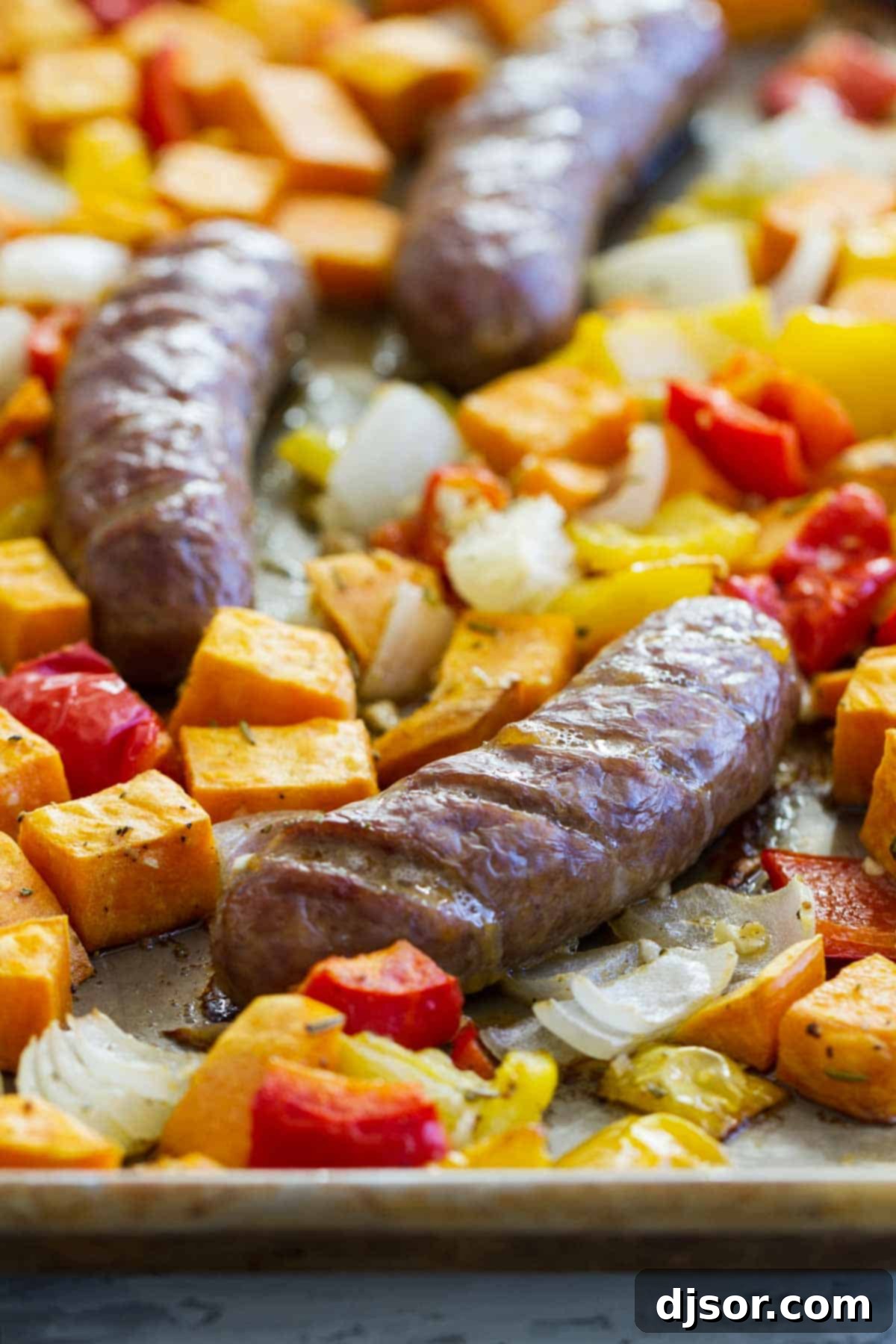 Sheet Pan Italian Sausage and Peppers Recipe with Sweet Potatoes - A wholesome and flavorful one-pan dinner idea.