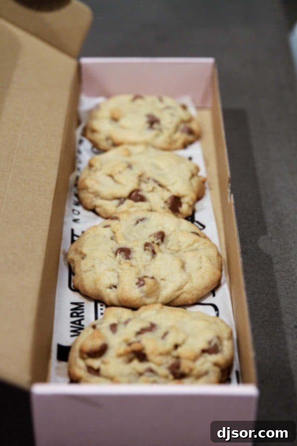 A box of freshly baked chocolate chip cookies from Crumbl Cookies in Utah.