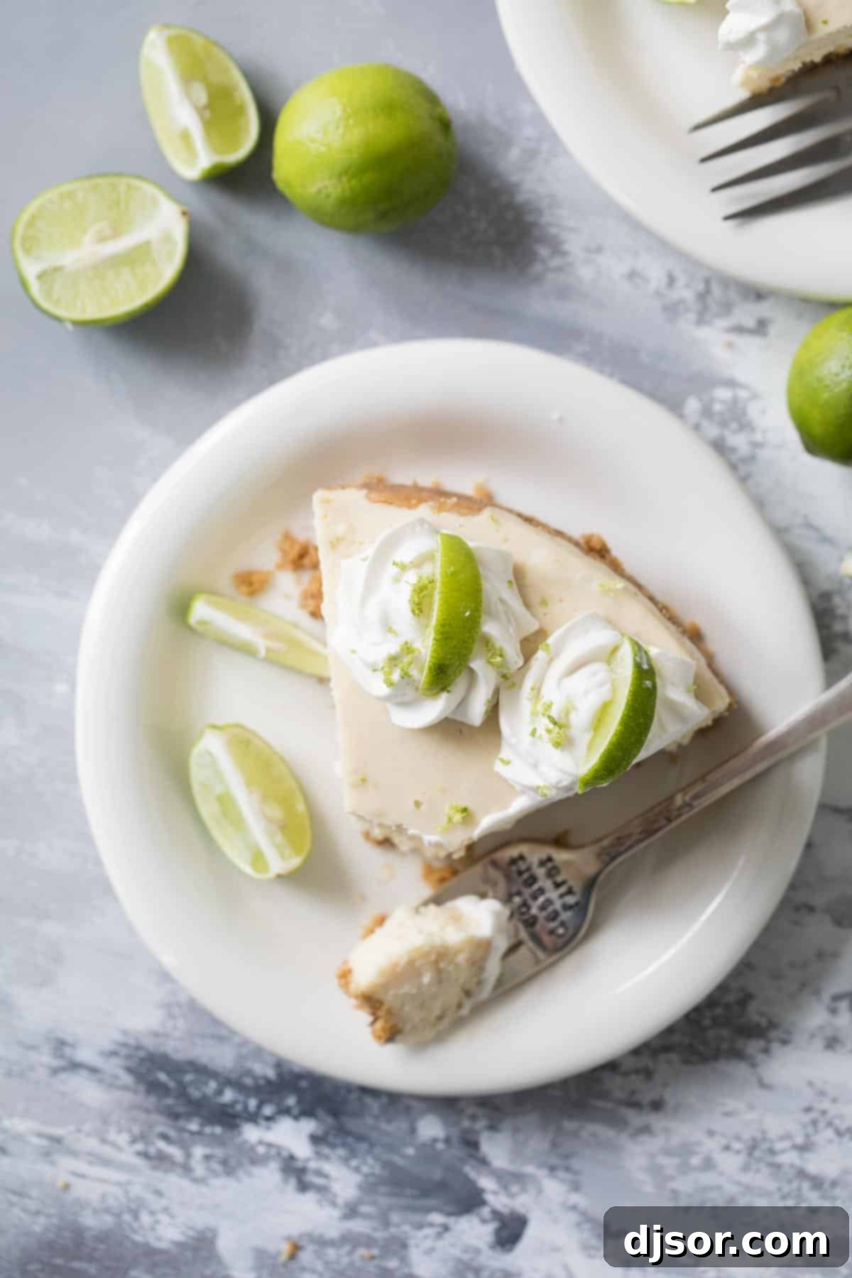 Key Lime Cheesecake Slice Ready to Enjoy Close-up of a slice of Instant Pot Key Lime Cheesecake with a fork