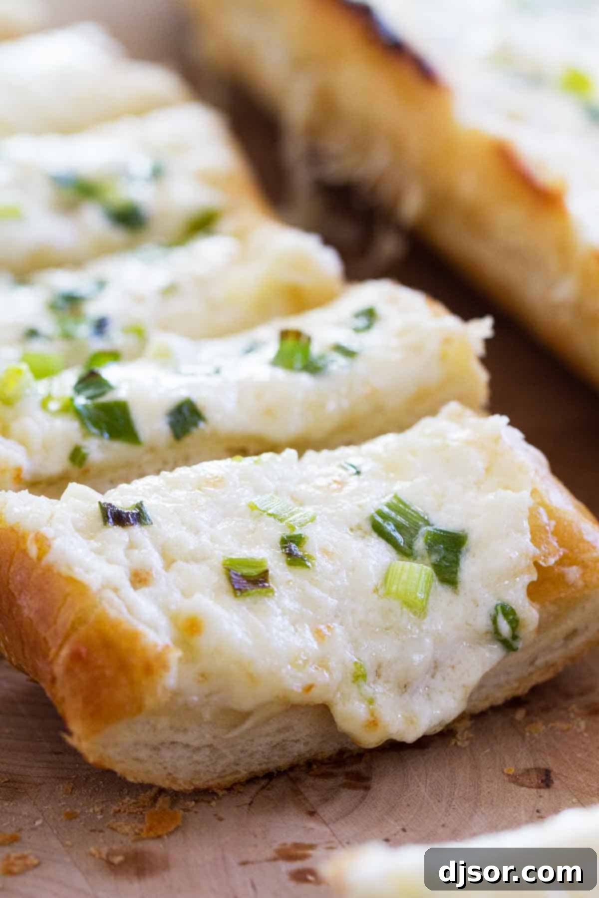 Slices of Cheesy Garlic Bread, perfectly golden brown with melted cheese