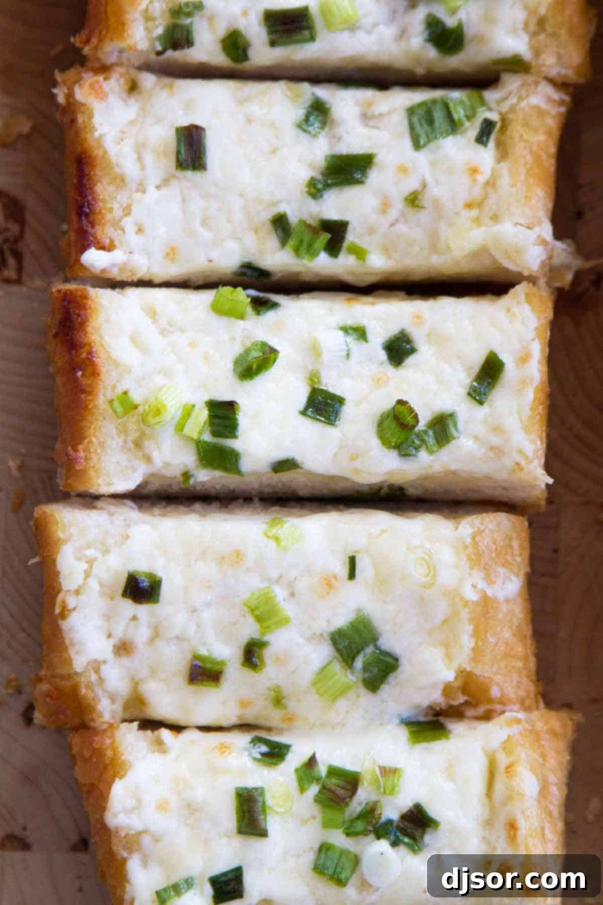 Close-up of Creamy Garlic Bread with Cheese, showing the texture