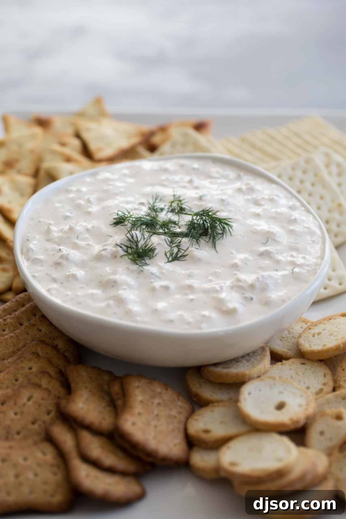 Delightful cold crab dip, a fresh and flavorful appetizer Cold Crab Dip Recipe garnished with fresh dill, ready to be enjoyed.