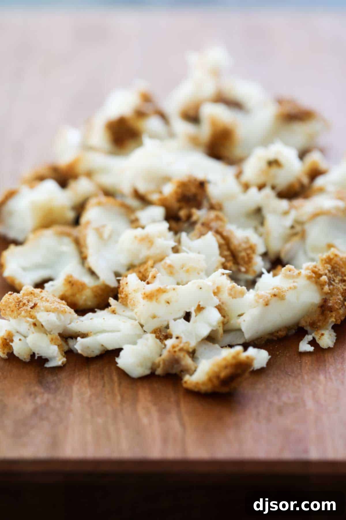 Perfectly Cooked Flaky Cajun Fish for Tacos Flaked Cajun-spiced white fish ready to be assembled into tacos.