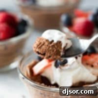 Close-up of fluffy chocolate mousse with its airy texture, ready for garnishing.