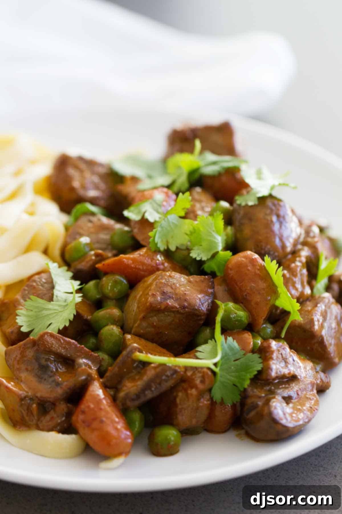 Chili Beef and Vegetables served over pasta, ready to be enjoyed as a hearty meal.