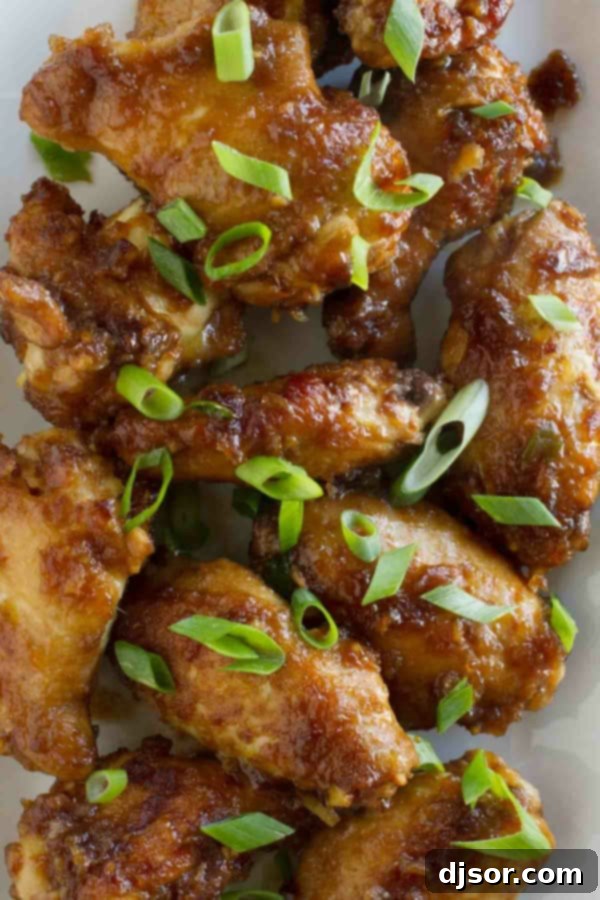 Imperial Wings 3 Empress Chicken Wings with sliced green onions scattered on top.