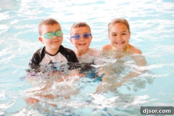Kids enjoying swimming at The Little America Hotel Salt Lake City