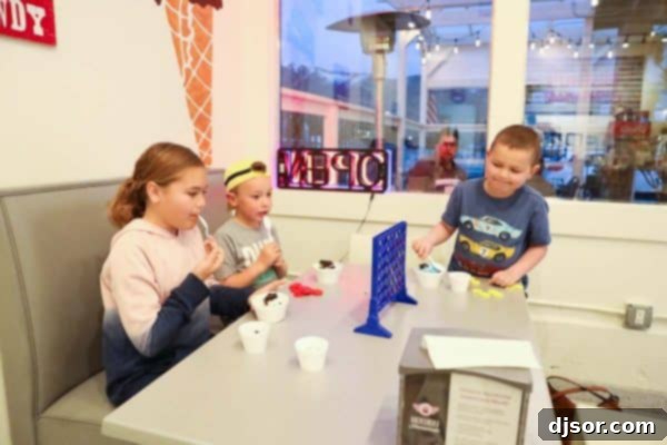 Kids playing games at Howdy Homemade Ice Cream in Salt Lake City