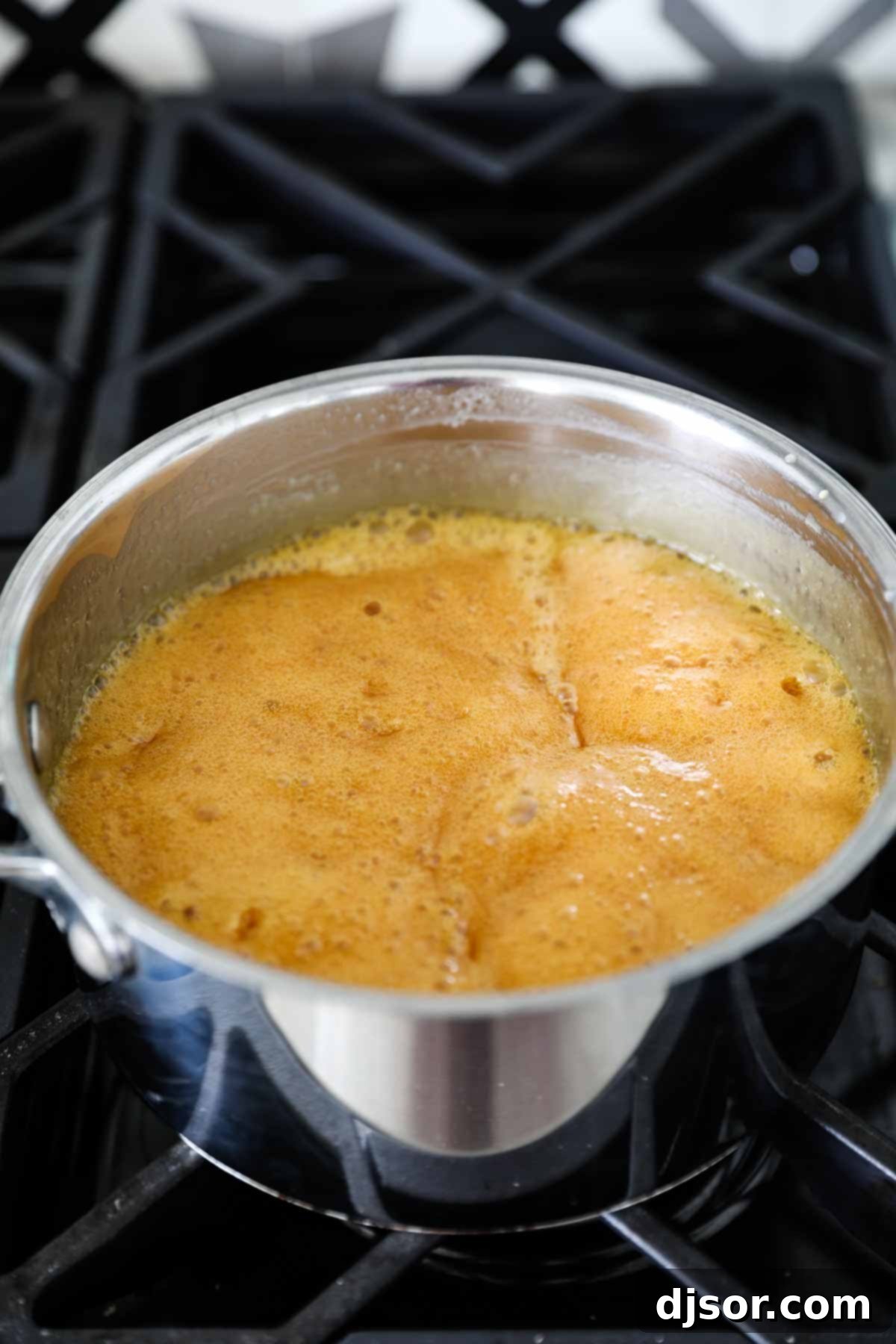 Recipe for Homemade Buttermilk Syrup simmering in a saucepan