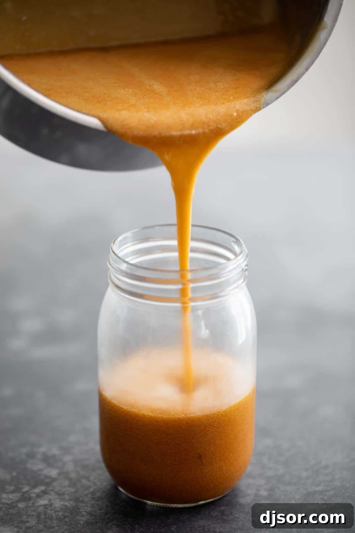 How to Make Homemade Buttermilk Syrup in a saucepan, showing its golden color and creamy texture
