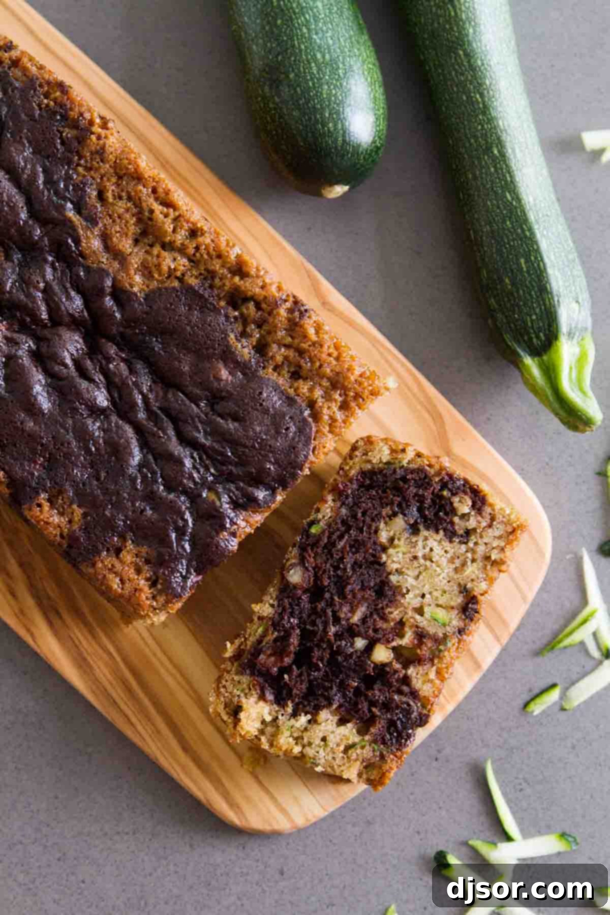 Top view of a beautifully baked Chocolate Wave Zucchini Bread loaf, showcasing its marbled texture