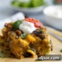 slice of sausage breakfast casserole on a wooden plate