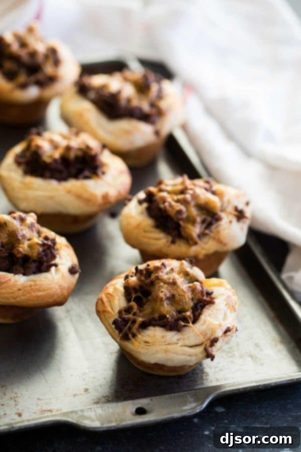 Dinner made easy - a ground beef and barbecue mixture is loaded into refrigerated biscuits and baked in these BBQ Beef Biscuit Cups. Easy BBQ Beef Biscuit Cups