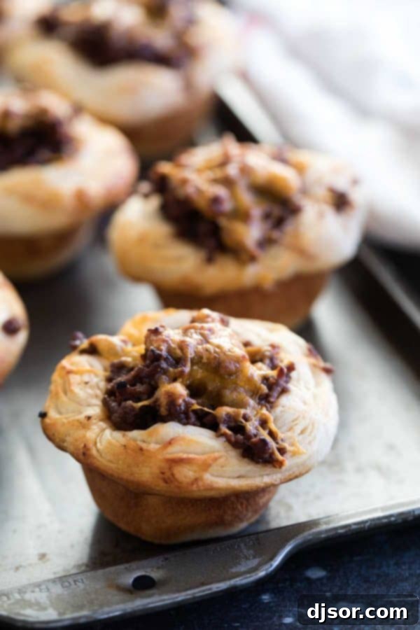 Dinner made easy - a ground beef and barbecue mixture is loaded into refrigerated biscuits and baked in these BBQ Beef Biscuit Cups. Easy Dinner BBQ Beef Biscuit Cups