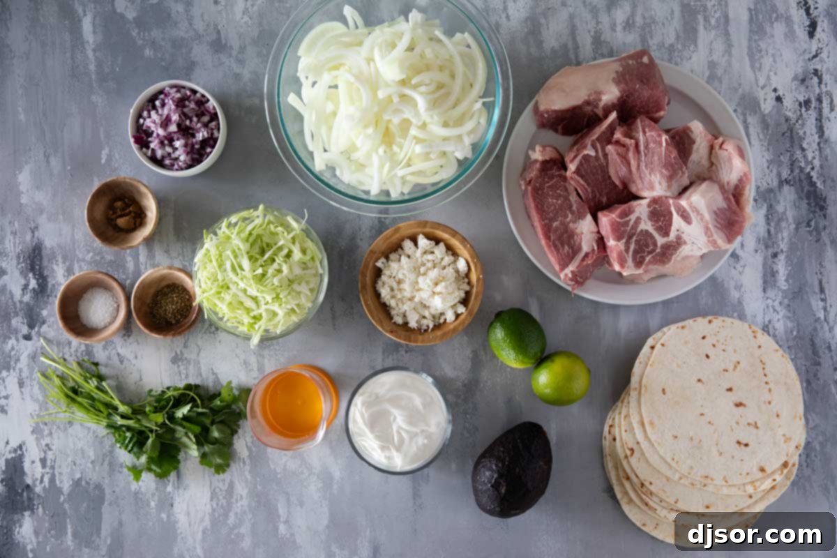 Arrangement of fresh ingredients including a pork roast, onions, and various spices, ready for making Shredded Pork Tacos.