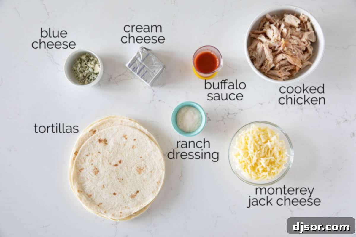 A vibrant flat lay image showcasing all the fresh ingredients needed to prepare Buffalo Chicken Taquitos, including shredded chicken, tortillas, cheeses, and buffalo sauce.