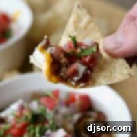 tortilla chip with 7 layer chili dog dip