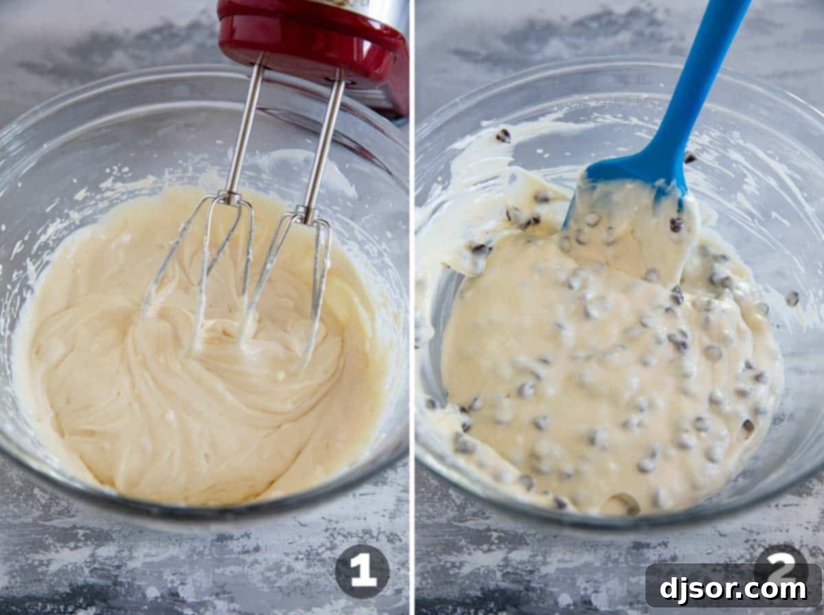 A bowl of creamy cheesecake filling with chocolate chips, ready for Black Bottom Cupcakes.