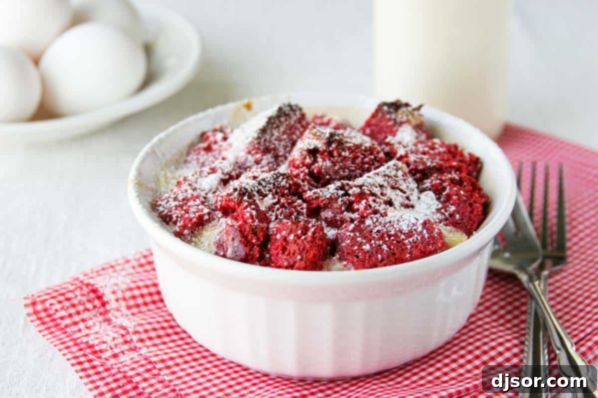 Visually stunning and incredibly tasty Red Velvet Bread Pudding. A single serving of vibrant red velvet bread pudding in a white ramekin, ready to be enjoyed.