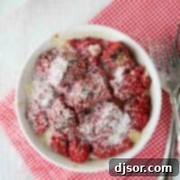 Red Velvet Bread Pudding Single serving of red velvet bread pudding topped with powdered sugar.