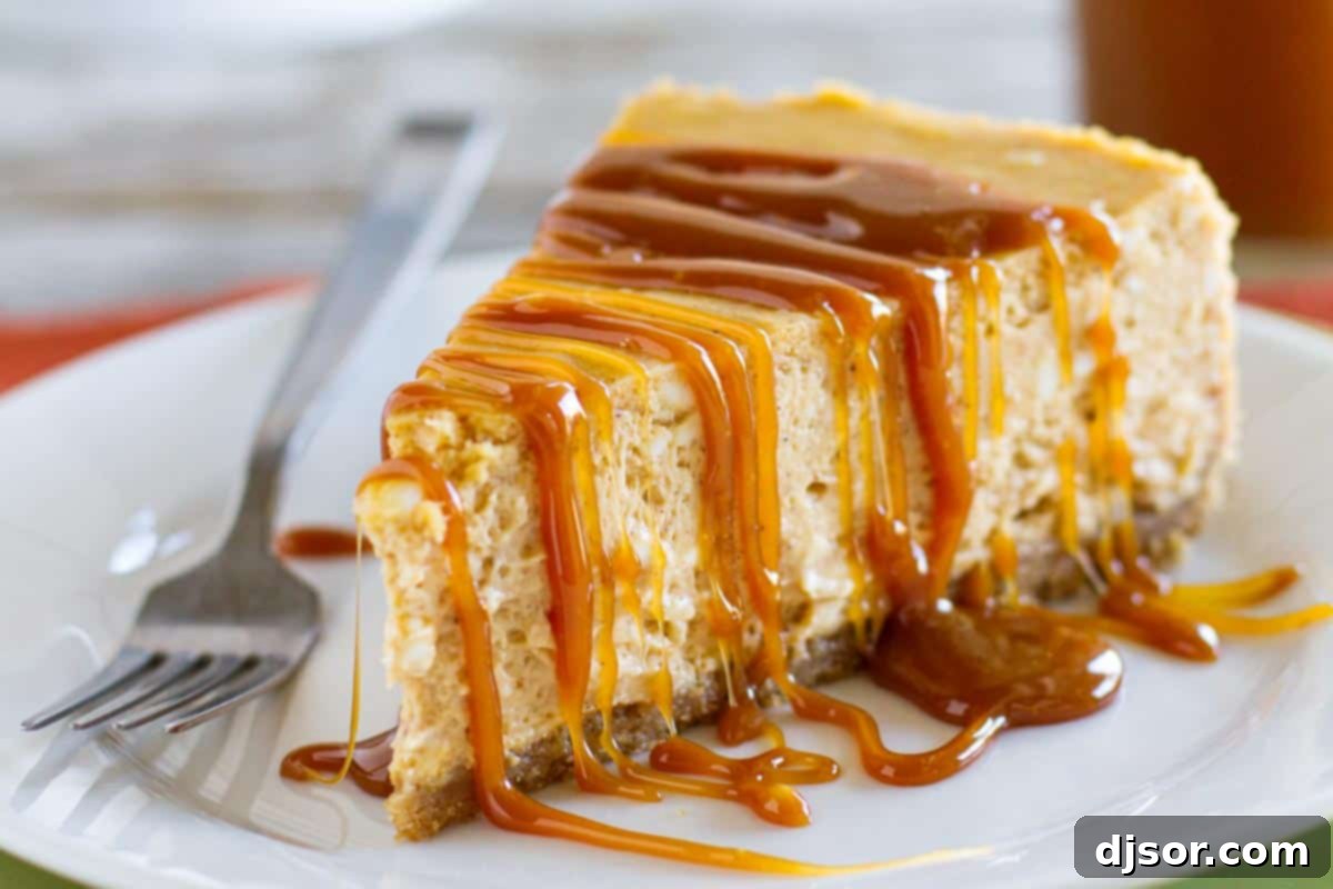 Smooth and Silky Pumpkin Cheesecake with Homemade Caramel A delectable slice of pumpkin cheesecake topped generously with golden caramel sauce, perfect for fall