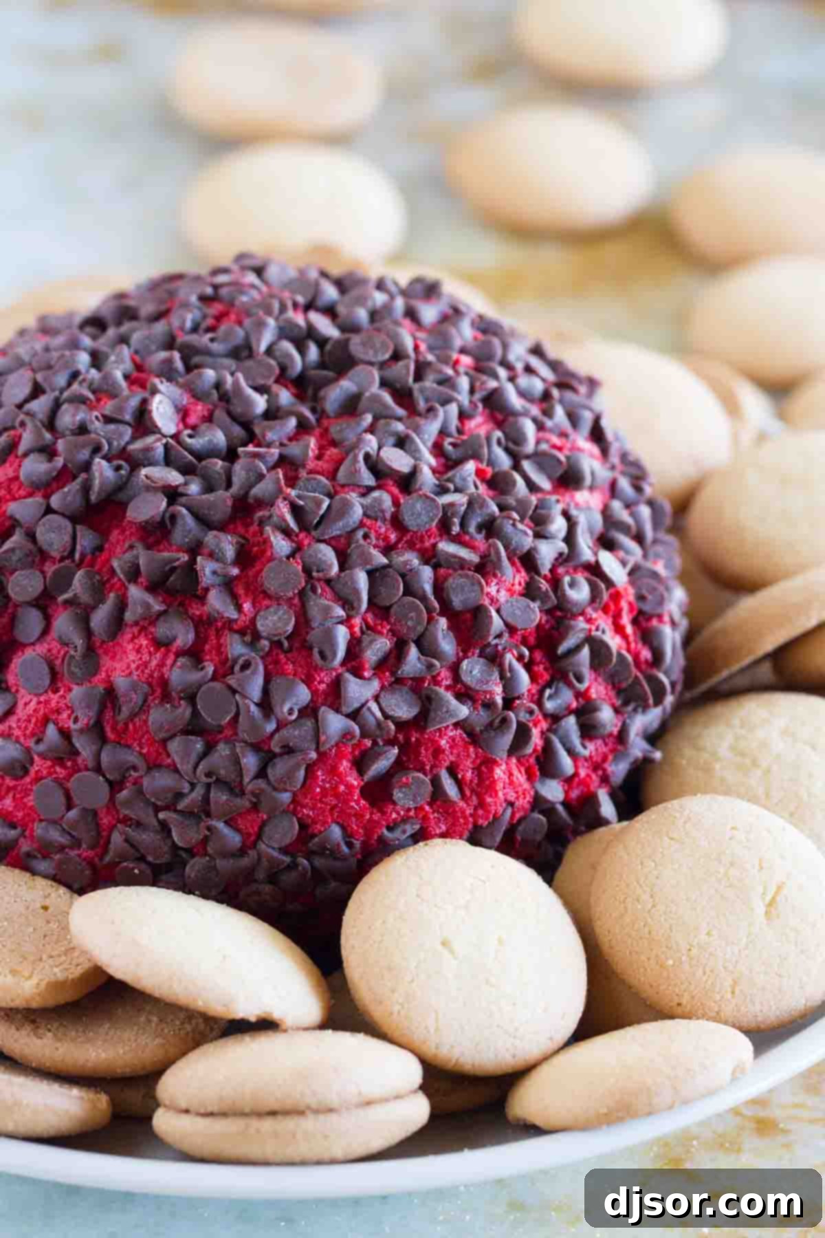 Velvet Red Cheese Truffles 2 Red Velvet Cheese Ball on a plate with cookies, a perfect sweet treat for parties
