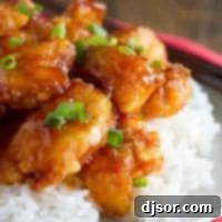 Sweet and sour chicken on top of rice