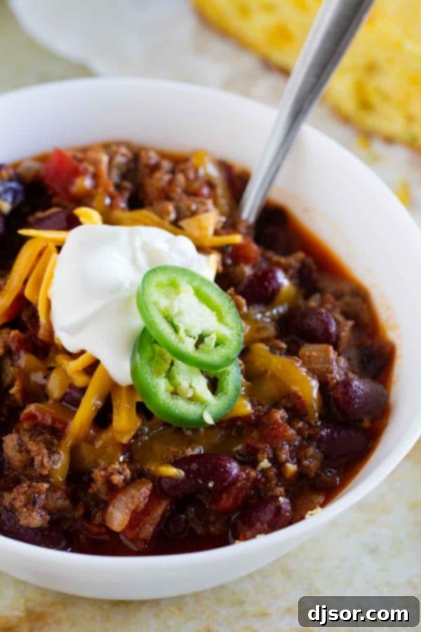 A beautifully plated bowl of Warm You Up Beef and Bean Chili, ready to be served with favorite toppings.