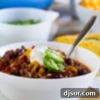 The perfect all-around chili recipe, this Warm You Up Beef and Bean Chili has all of your favorite chili ingredients, plus some bacon for added smokiness.