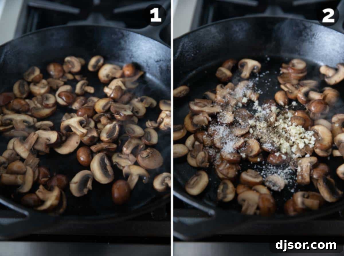 Mushrooms sautéing in a cast iron pan, with garlic and salt being added.