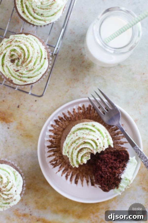 Top view of chocolate mint cupcakes frosted with green Swiss meringue buttercream.