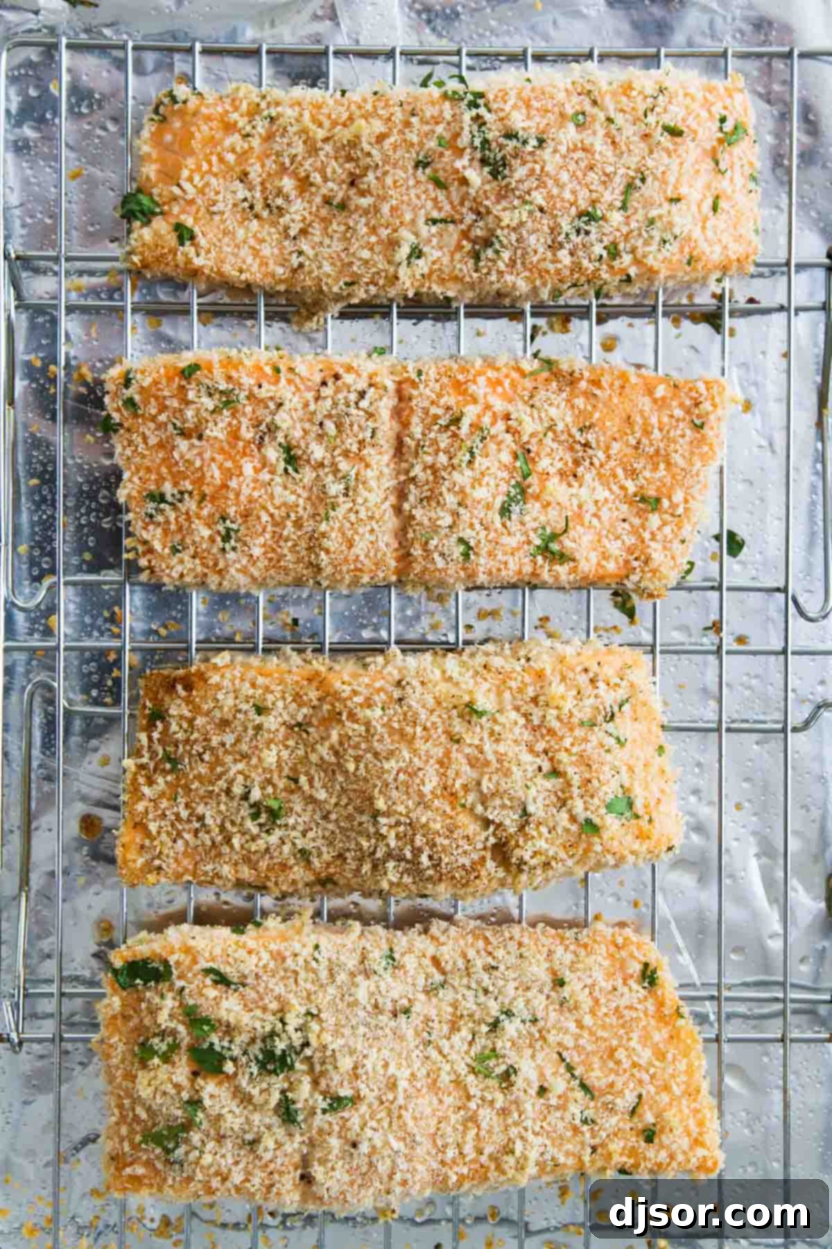 Perfectly golden-brown Panko Crusted Salmon fillets arranged on a cooling rack, ready to be served.