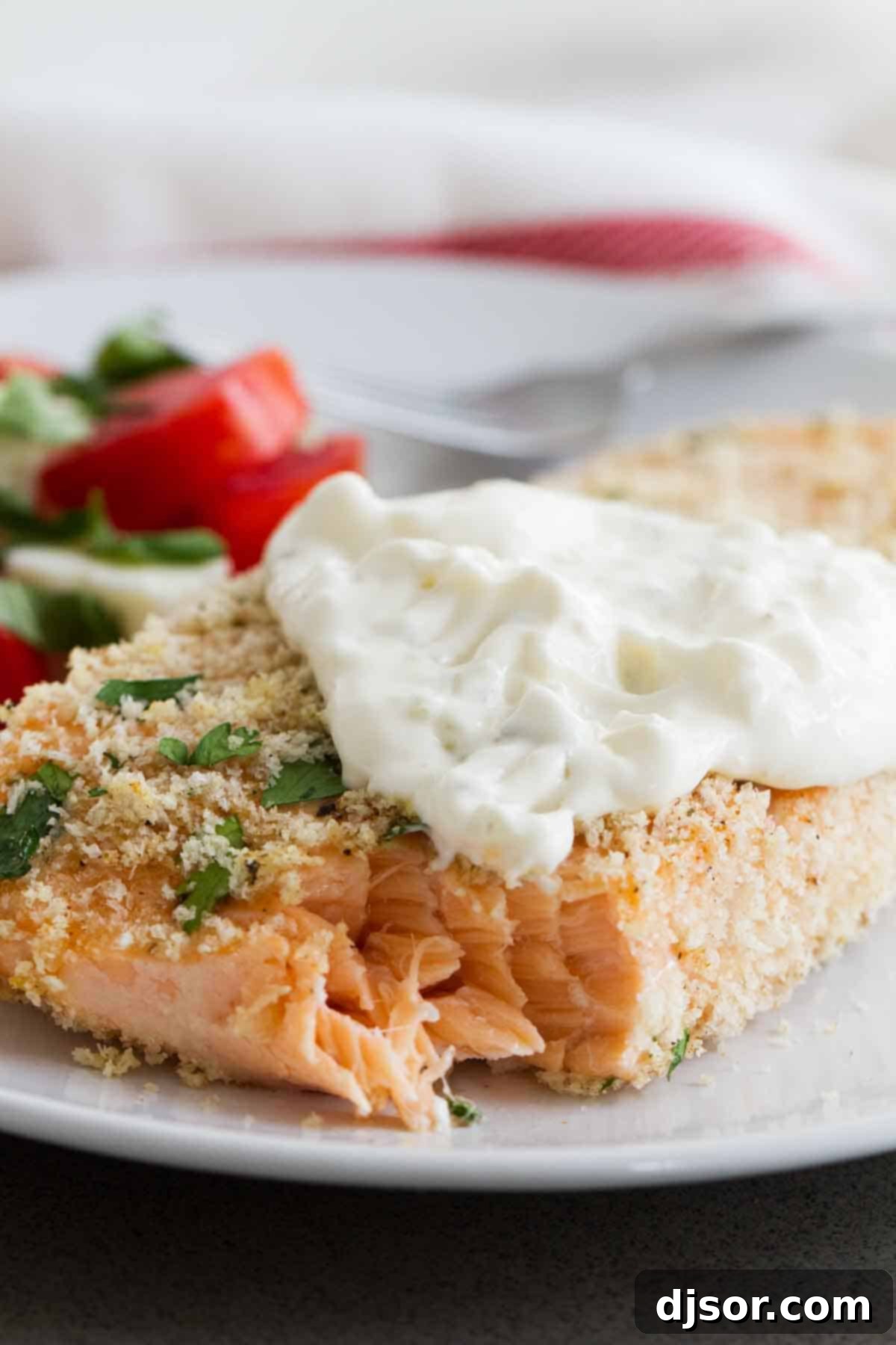 Close-up texture of Panko Crusted Salmon and a dollop of Homemade Tartar Sauce, highlighting the crispiness.