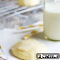 Lemon Ricotta Cookie on a napkin with milk and straws