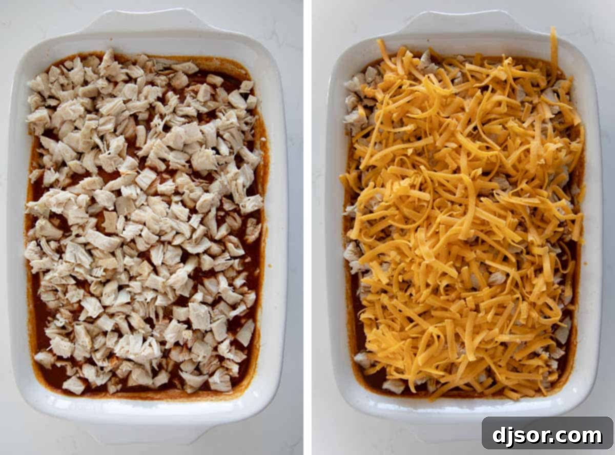 A chicken tamale casserole layered with rich red enchilada sauce, tender chicken, and shredded cheese, ready for its final bake.