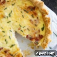 Classic Quiche Lorraine 2 overhead view of quiche lorraine with one slice cut out