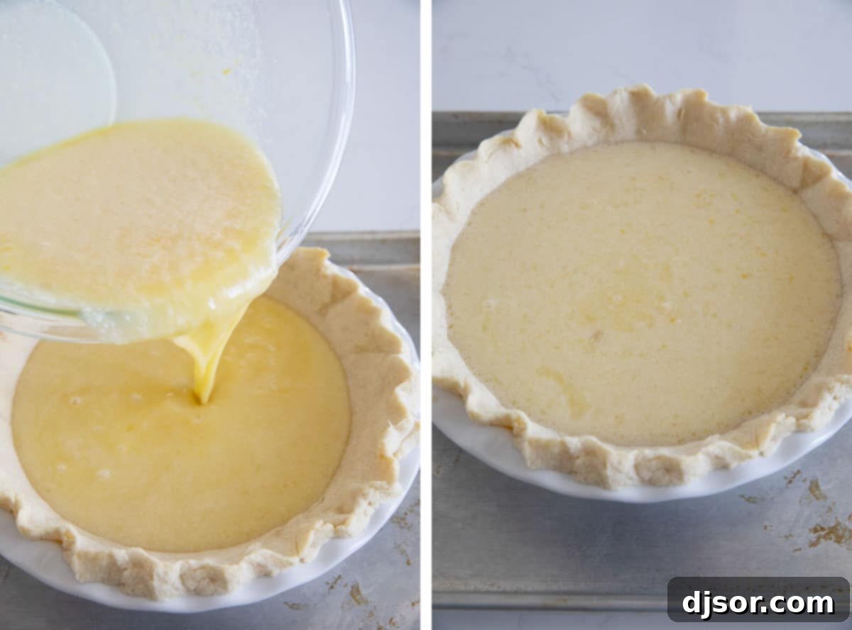 A golden, smooth lemon chess pie filling being poured into a partially baked pie crust in a pie plate.