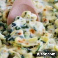 A delicious serving of Spinach and Artichoke Tortellini Bake.