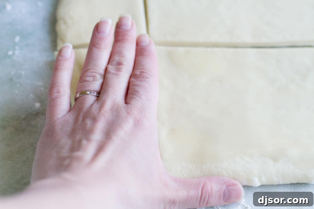 Dough strips cut into 2x4-inch rectangles, ready for shaping.