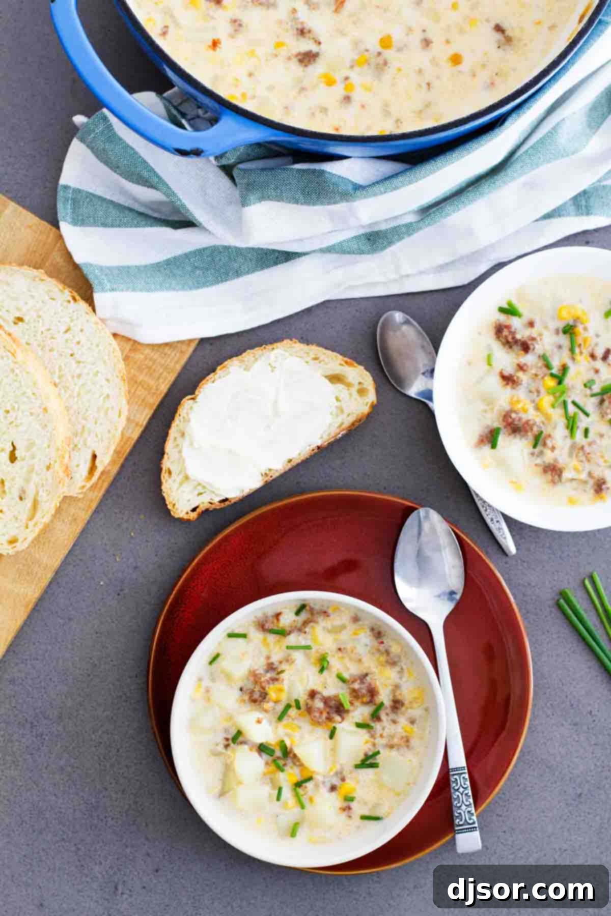 Easy Corn and Sausage Chowder - warm, comforting, filling and perfect for a cold day! This easy soup only takes a few ingredients and can be on the table in 40 minutes. Overhead view of a pot and bowl filled with rich Corn and Sausage Chowder, showcasing its creamy texture and chunky ingredients.