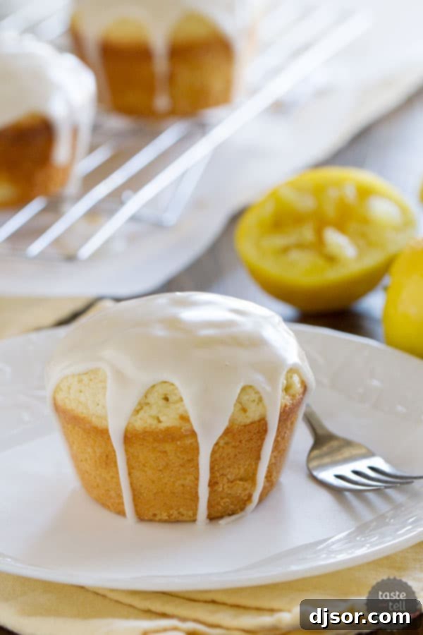 Individual Glazed Lemon Cakes ready to be enjoyed, highlighting their moist texture and vibrant lemon flavor.