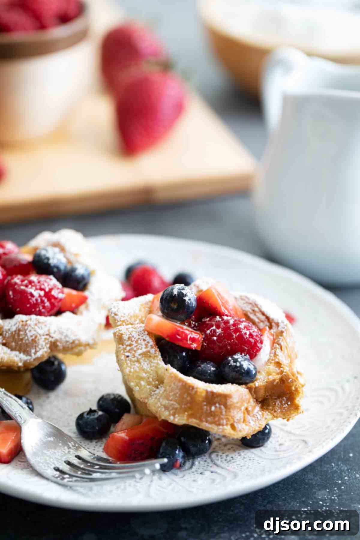 French Toast Cups filled with fresh berries on a plate